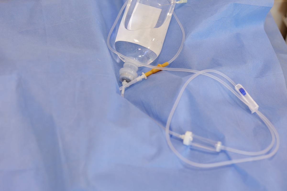 IV infusion bottle with tubing in hospital setting