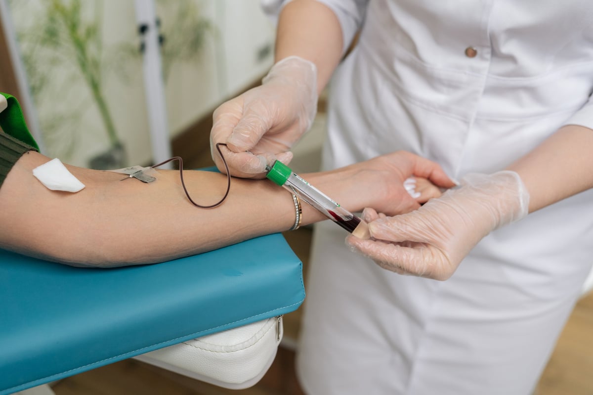 Healthcare professional performing venipuncture